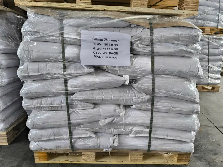 Pallet of 25 kg seabird guano bags shrink-wrapped and labelled Guano 2500 mesh, 43 bags at 1,075 kg net weight